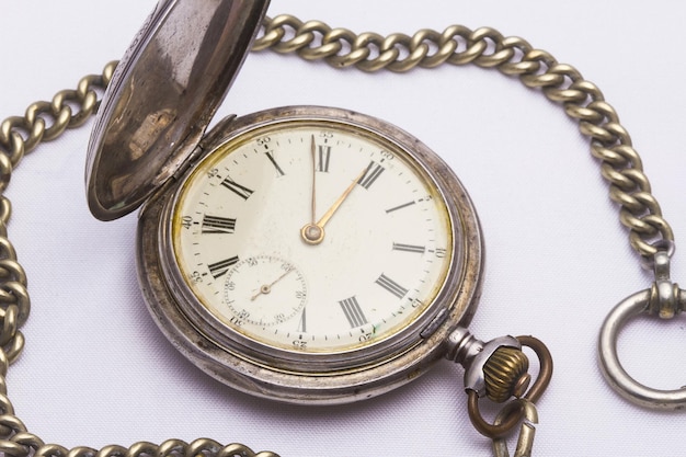 Old pocket watch with white background