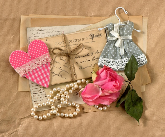 Old post cards flower heart and perls necklace