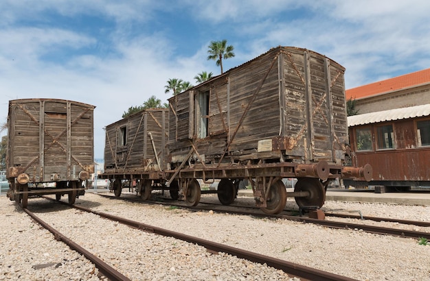 Old railway cars stand on the track