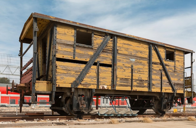 Old railway cars stand on the track