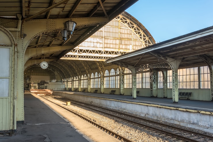 Photo old railway station with a platform clock empty without people.