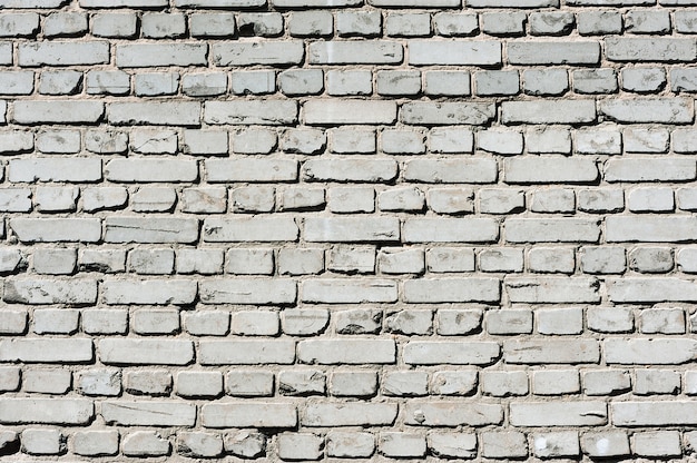 白いレンガで作られた古い現実的なレンガの壁
