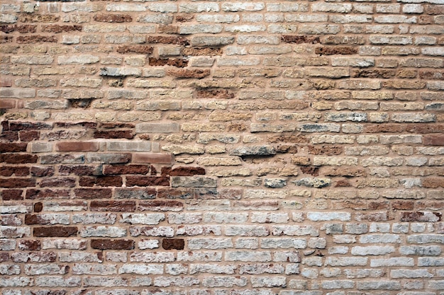 Old red brick castle wall for background