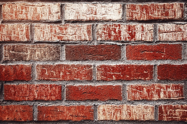 古い赤レンガの壁の正面のテクスチャの背景