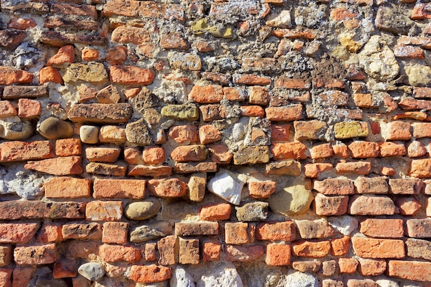 Old red brick wall texture, Siena, Tuscany region, Italy