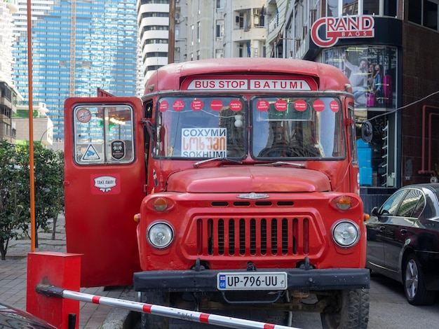 Old red bus on the street Soviet auto industry An old bus converted into a coffee shop Business idea vintage car