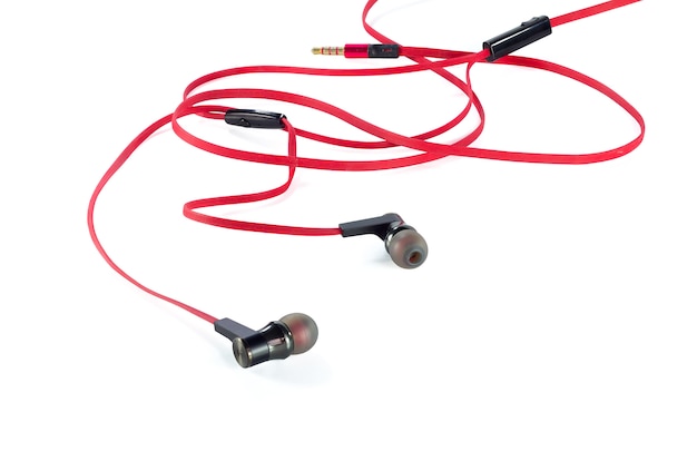 Old red earphones isolated