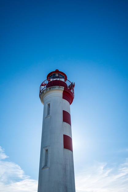 Old red lighthouse in La Rochelle harbor, France