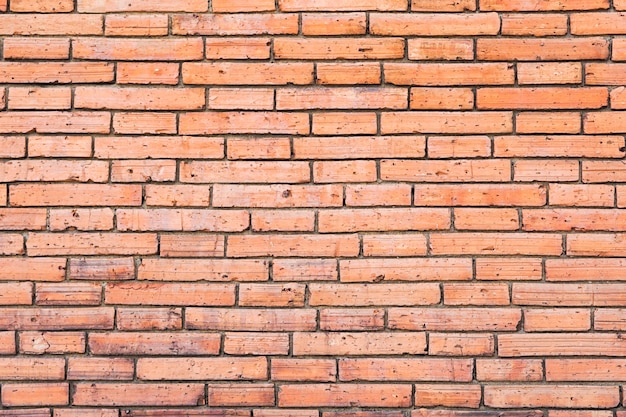 Old red retro brick wall of Tha Phae Gate in Chiang Mai, Thailand.