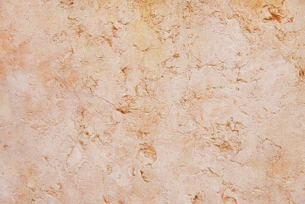 Old red stone granite wall background texture