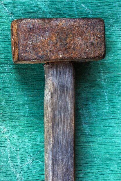 Old reliable tool for dismantling lying on a wooden surface Proven remedy for hard action