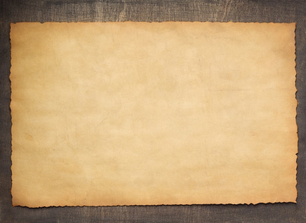 Photo old retro aged paper parchment  at wooden background