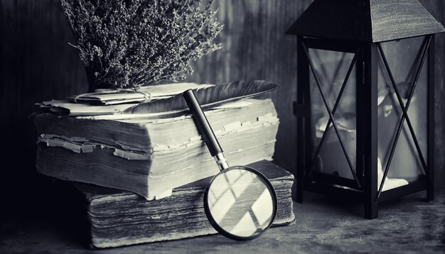 An old retro book on the table. An encyclopedia of the past on an old wooden countertop. An old book from the bibiotics, a folio, a constitution, bible.