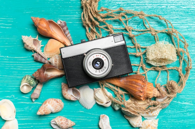 Old retro camera on wooden table background