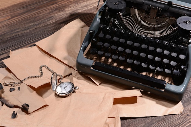 Old retro typewriter on table closeup