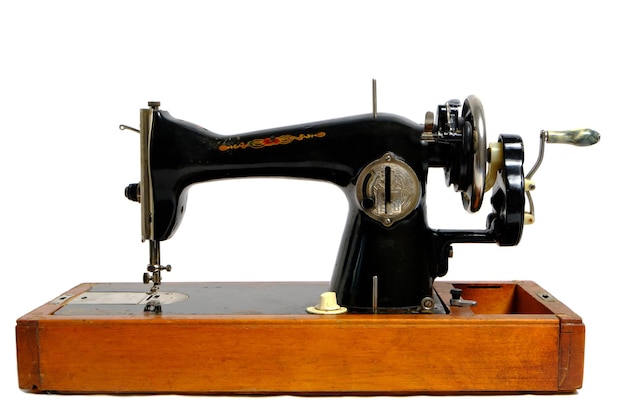 Old, retro vintage sewing machine on a white background.