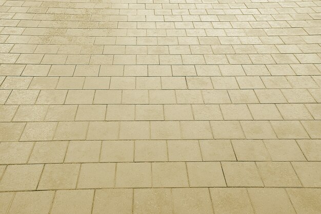 Old road beige mosaic pavement texture