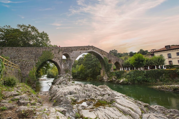 Old Roman stone bridge in Cangas de Onis Asturias Spain in a sunny day