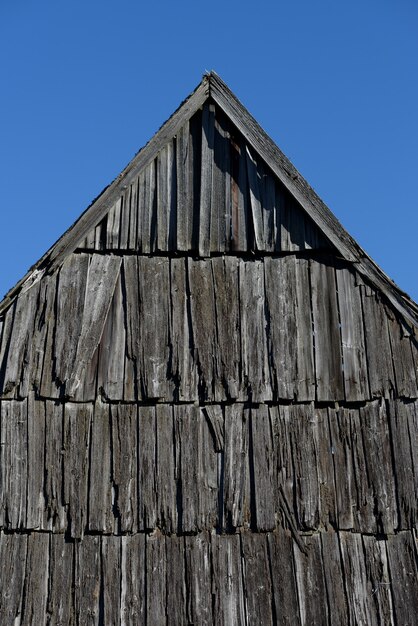 Old roof made of wood. Traditional rural architecture. Background for design. Carpathians Mountains, Ukraine