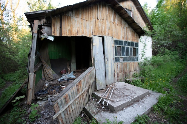 Old ruined wooden nonresidential buildingWaste old wooden house