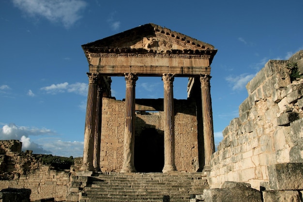 Photo old ruins against blue sky at dougga