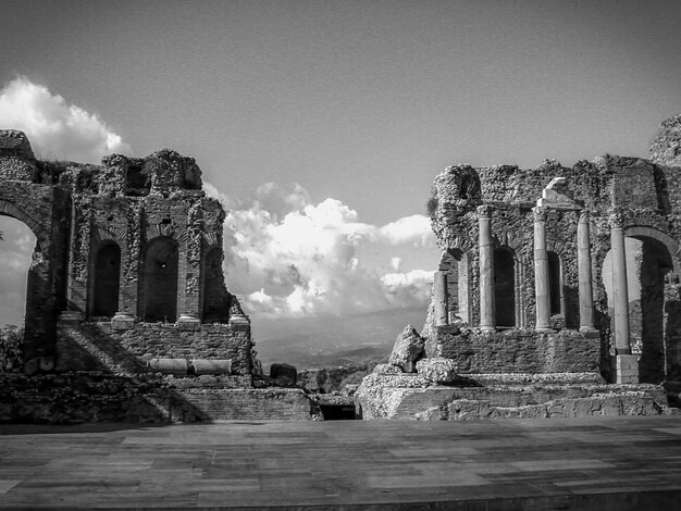 Old ruins at greek theatre against sky