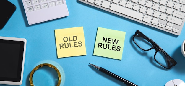 Old Rules and New Rules text on sticky notes with a business objects