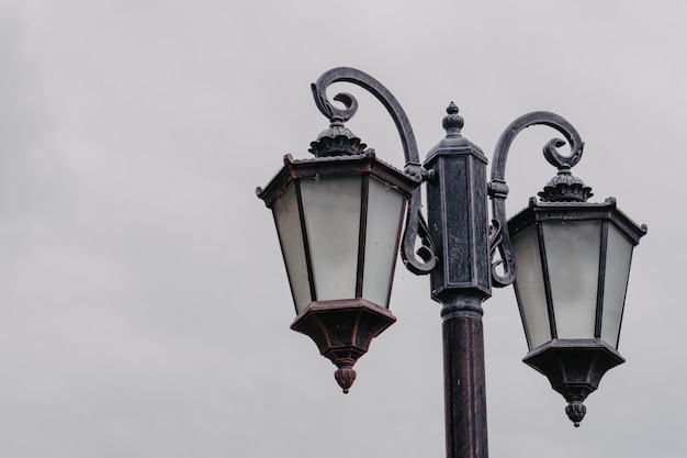 Old rusted lamppost on a cloudy day