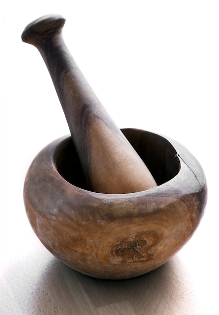 Old rustic wooden pestle and mortar