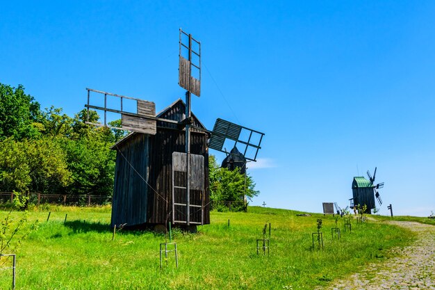 Old rustic wooden wind mill in Pyrohiv Ukraine