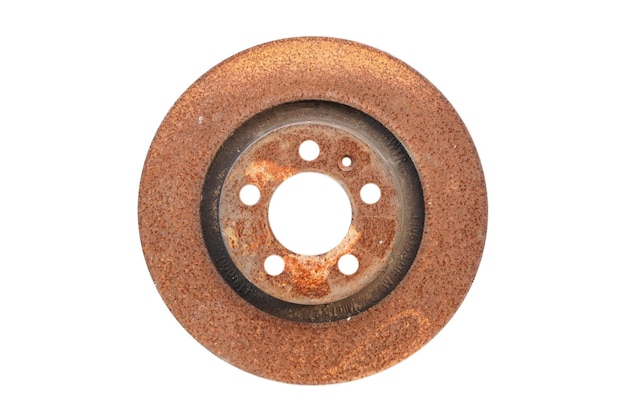 Old rusty brake disc from car isolated on white background