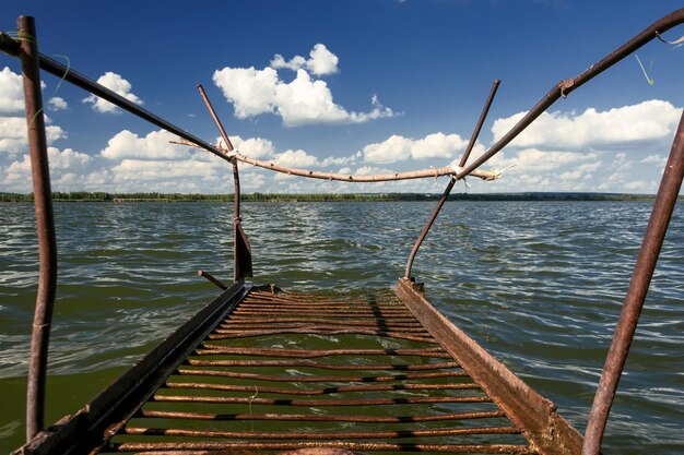 Old rusty metal bridges on the lake