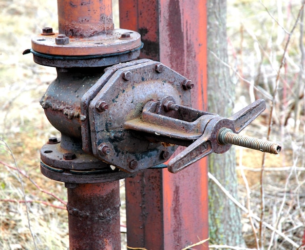 The old rusty water tap crane a latch