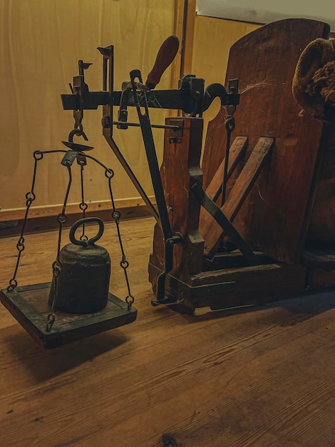 Old scales on a wooden table Retro style toned photo