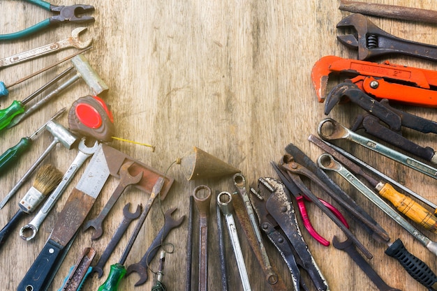 old set of work tool on wooden background