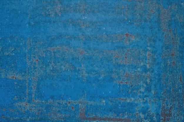 古いぼろぼろに塗られた青い金属の表面の背景