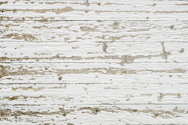 古いぼろぼろの白い風化した木の板の背景