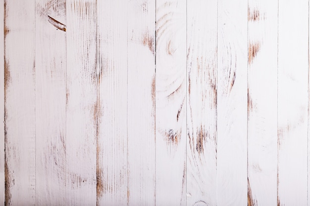 デザインのための古いぼろぼろの白い木製の壁