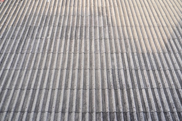 Old slate on the roof of gray color