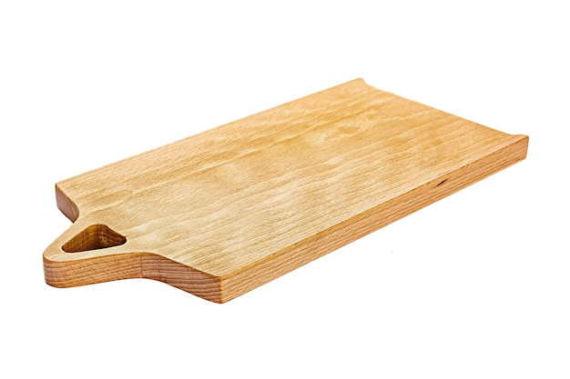 Old stained clean empty rectangular wooden cutting board isolated on white in an oblique low angle view for food placement.