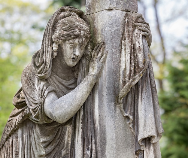 Old statue on grave in the Lychakivskyj cemetery of Lviv, Ukraine.