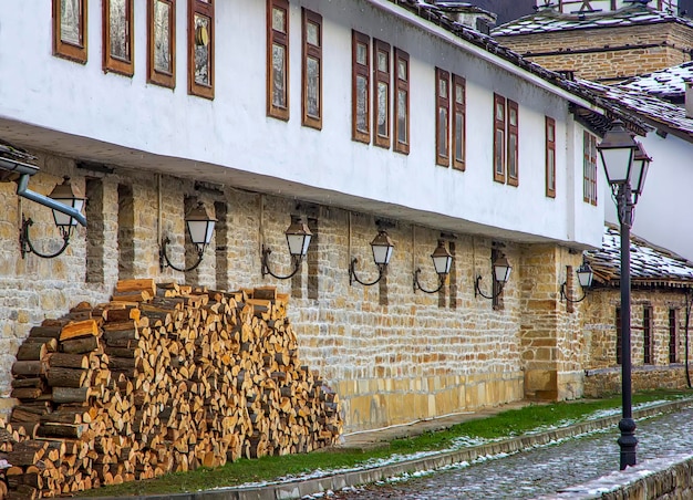 Old stone house with ready firewood