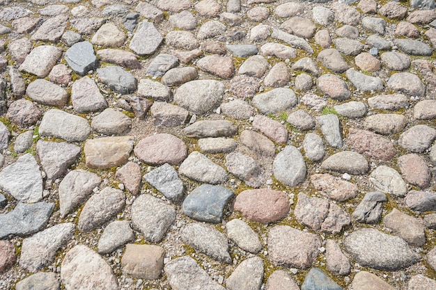Текстура старого каменного тротуара Абстрактный фон булыжного тротуара Бесшовная текстура