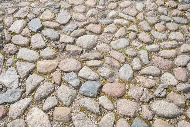 Old stone pavement texture Abstract background of cobblestone pavement Seamless texture