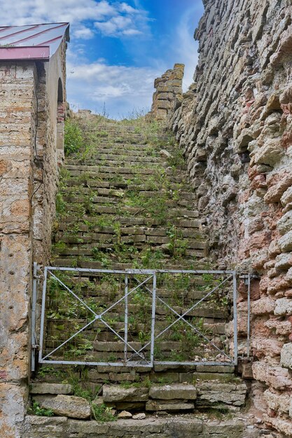 An old stone staircase leading to the sky