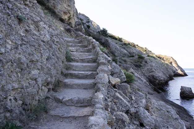 An old stone staircase in the mountains near the sea