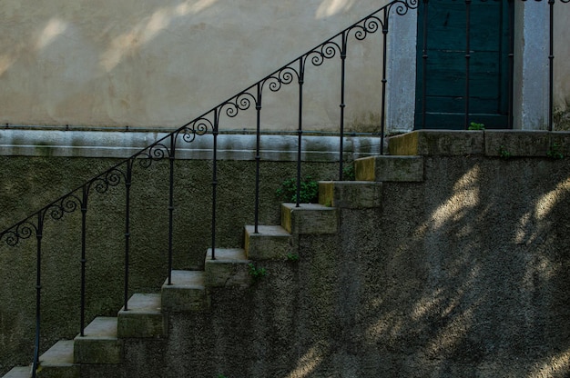 Old stone steps with wrought iron railings