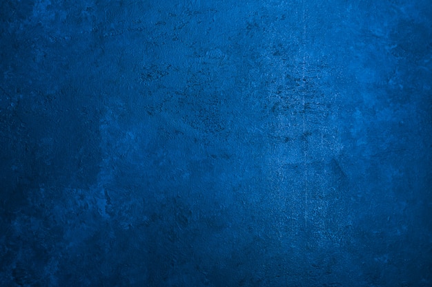 Old stone texture background toned classic blue color