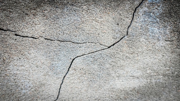 Vecchio muro di pietra con una crepa. trama per il design