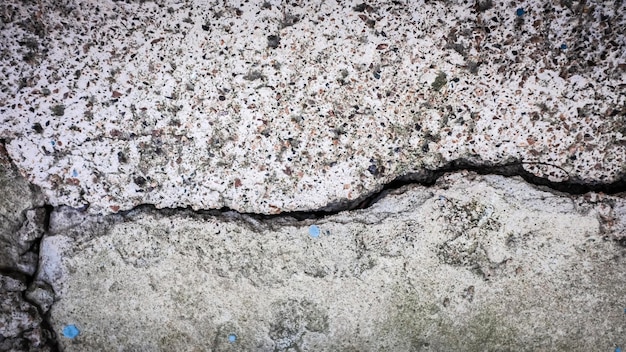 Old stone wall with a crack. texture for design